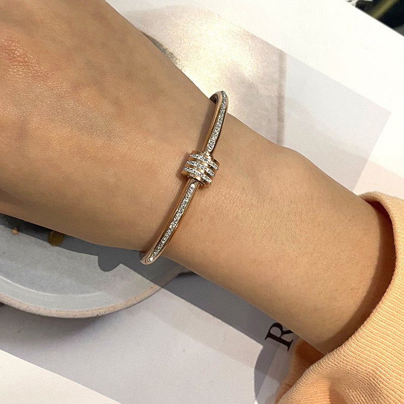 Stainless Steel Gold, Rose Gold and Silver Plated American Diamond Studded Bangle Style Bracelet