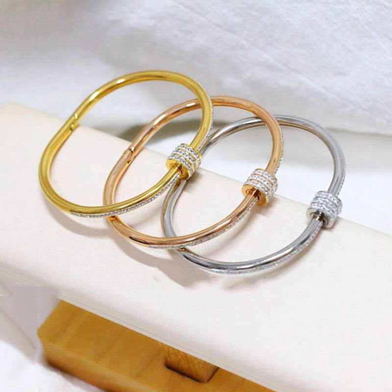 Stainless Steel Gold, Rose Gold and Silver Plated American Diamond Studded Bangle Style Bracelet