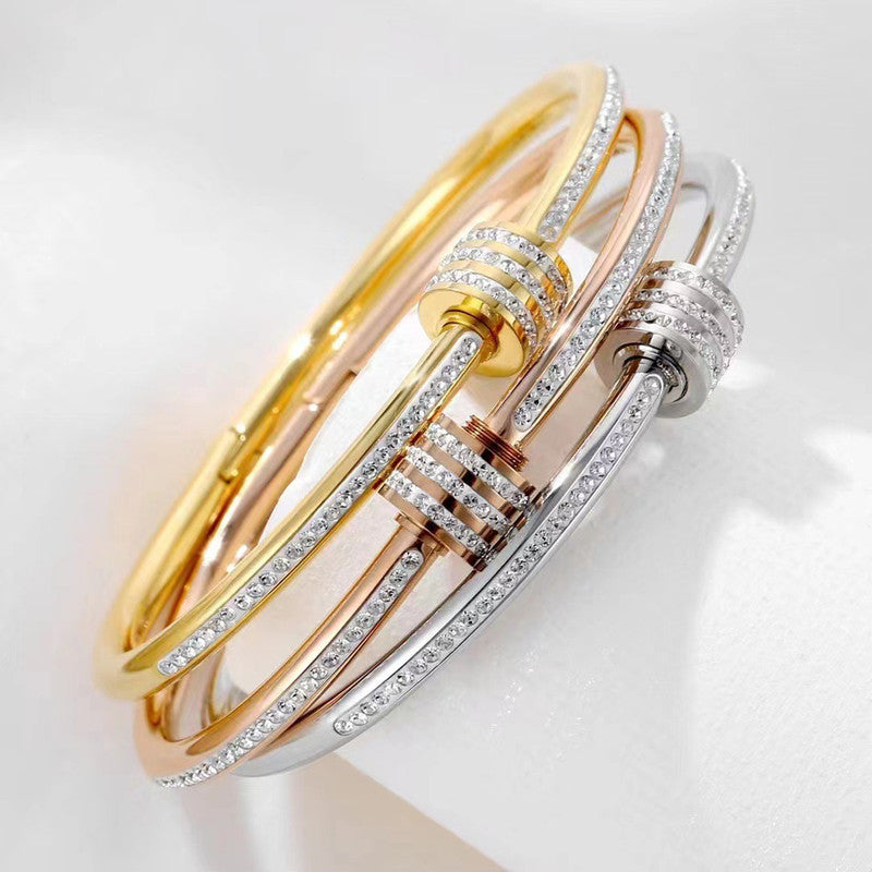 Stainless Steel Gold, Rose Gold and Silver Plated American Diamond Studded Bangle Style Bracelet
