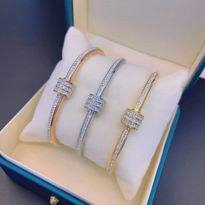 Stainless Steel Gold, Rose Gold and Silver Plated American Diamond Studded Bangle Style Bracelet